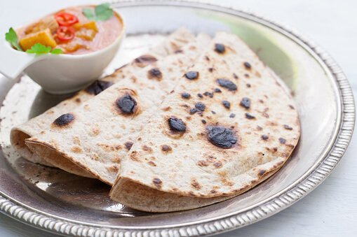 Indian tikka masala chicken and naan flat bread